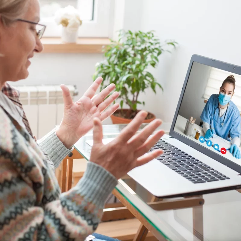 Patient consulting a doctor by video call for a telehealth appointment