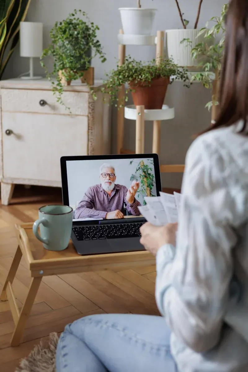 A woman having a video consultation from home